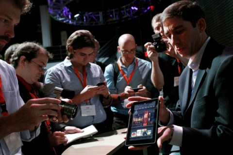 Reporters crowd around the new Kindle Fire at a news conference during the launch of Amazon's new tablets in New York