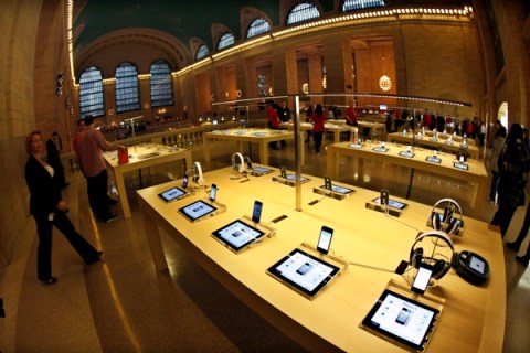 Apple iPad tablets and iPhones are seen on display inside the newest Apple Store in New York City's Grand Central Station during a press preview