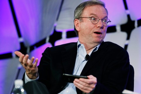 Google's Executive Chairman Schmidt, holding a cellphone running Google software, speaks on a panel discussion on the opening day of the Consumer Electronics Show in Las Vegas