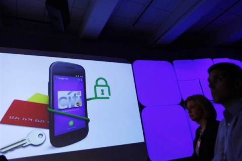 Attendees watch a demonstration of the Google wallet application during a news conference unveiling the mobile payment system in New York