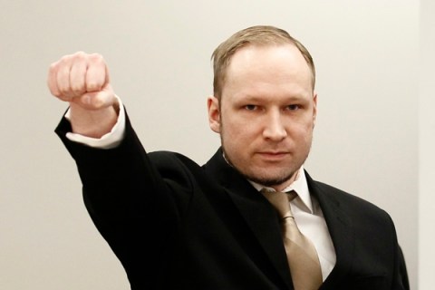 Breivik clenches his fist as he arrives to courtroom for the first day of his trial  in Oslo