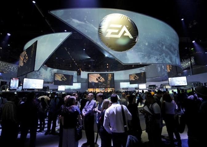 Attendees visit the Electronic Arts booth