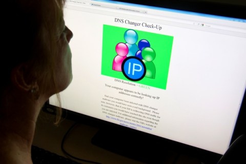 A woman looks at a website designed to c