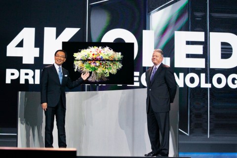 Panasonic chief Tsuga and CEO Taylor introduce the company's new OLED television during the Panasonic opening day keynote at the Consumer Electronics Show in Las Vegas