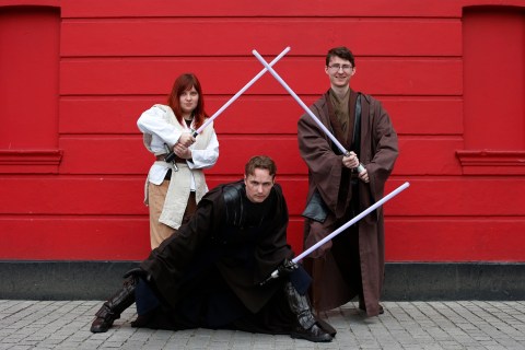 Science fiction enthusiasts Di Trolio, Comber and Gumley-Mason, dressed as characters from Star Wars, pose for a photograph in east London
