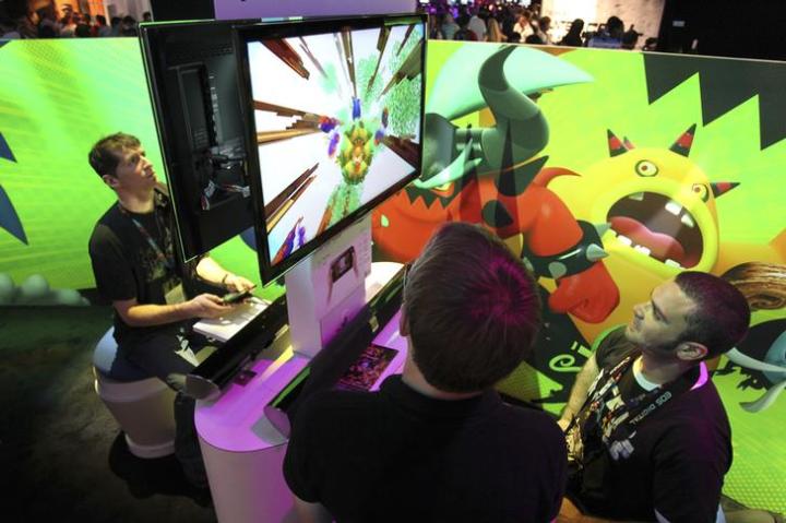 Show attendees play Sonic Lost World at the Sega exhibit at E3, the Electronic Entertainment Expo, in Los Angeles
