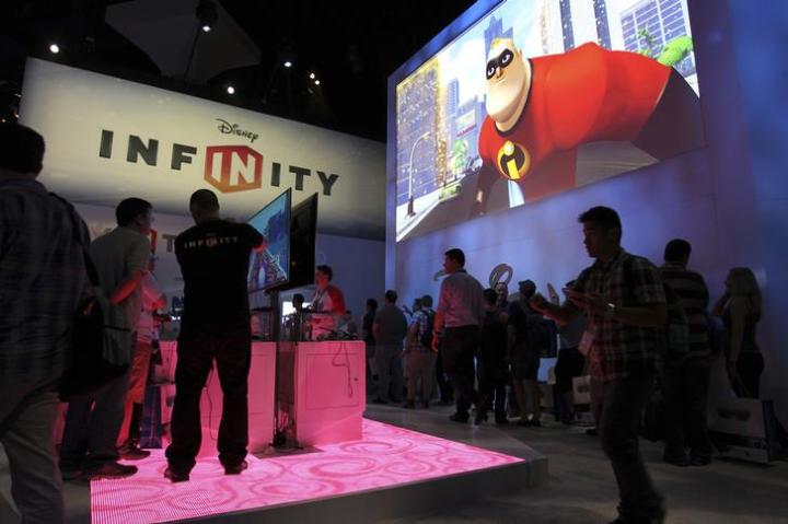People visit the Disney Infinity exhibit at E3, the Electronic Entertainment Expo, in Los Angeles, California.