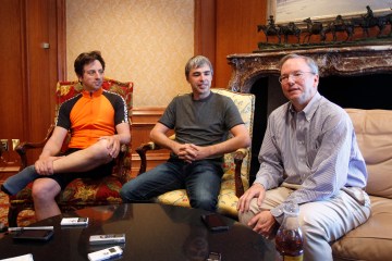Google Chairman and CEO Eric Schmidt speaks beside co-founders Sergey Brin and Larry Page at the Sun Valley Inn in Sun Valley