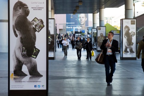 Man walks by advertisement for Corning Gorilla Glass 3 outside Las Vegas Convention Center on first day of Consumer Electronics Show in Las Vegas
